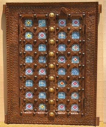 Original hand-painted glass tile and brass dome door wall panel in dark walnut
