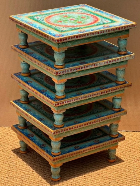 Hand-painted Bajot Chowki low tables stacked showing teal blue-green colour with floral medallion top