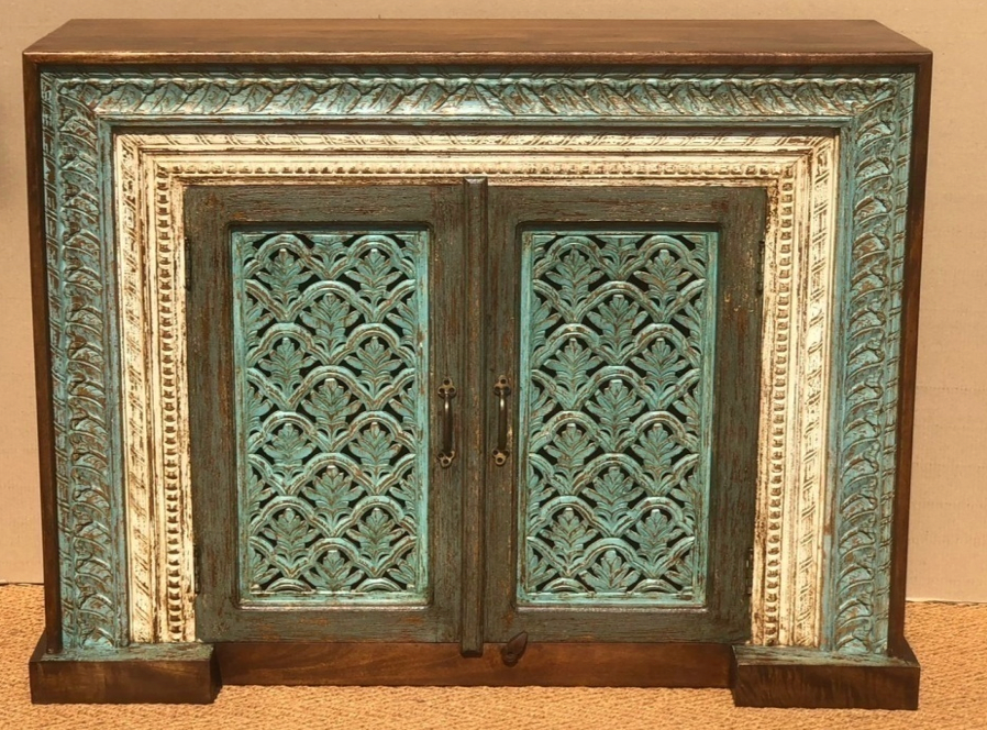 Hand-carved teal and dark wood sideboard cabinet with fan-palmette carved doors and ornate stepped frame