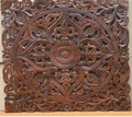 Hand-carved dark walnut mango wood square wall panel with central floral mandala medallion and open scrolling acanthus vine cutwork