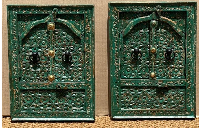 Pair of hand-carved green Moroccan Jharokha window mirrors closed showing star jali shutters and brass hardware