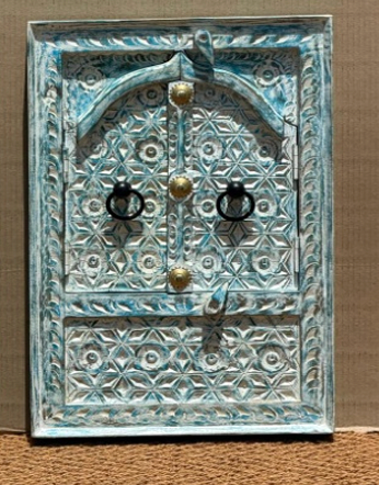 Hand-carved blue-grey teal Moroccan Jharokha window mirror closed showing star jali shutters and brass hardware