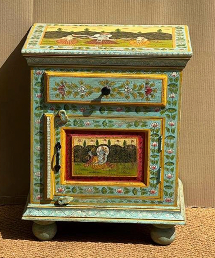 Hand-painted Mughal miniature mango wood bedside cabinet in antique teal-green with leaf vine surround, landscape top, floral drawer and court scene door miniature