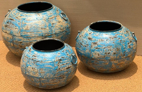 Set of three distressed iron globe pots in heavily cracked and chipped sky blue turquoise finish with horizontal ribbing, small open neck and iron ring handles on each side