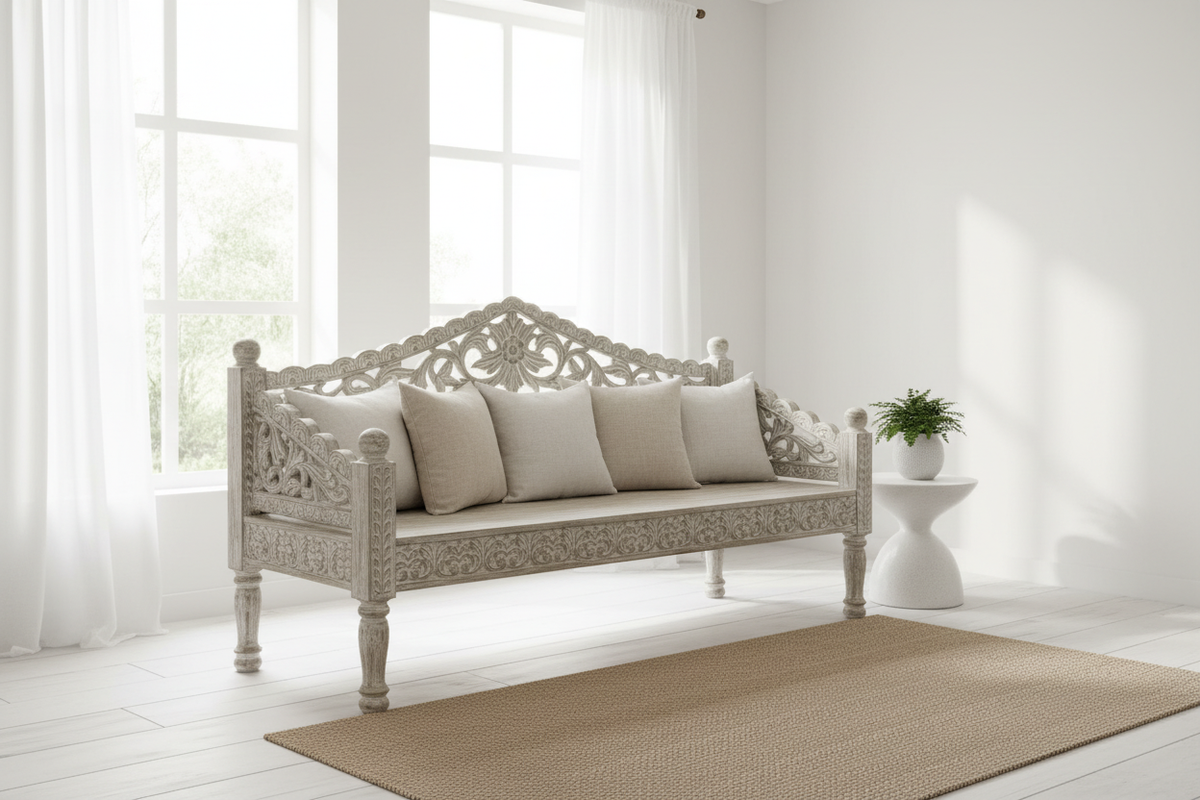 Whitewash carved daybed bench in minimalist Scandinavian room with linen cushions