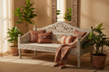 Whitewash carved mango wood daybed bench in warm Rajasthani living room with earthy textiles