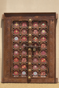 Copper brown double-door wall panel with pink glass tiles – front hero in warm entryway