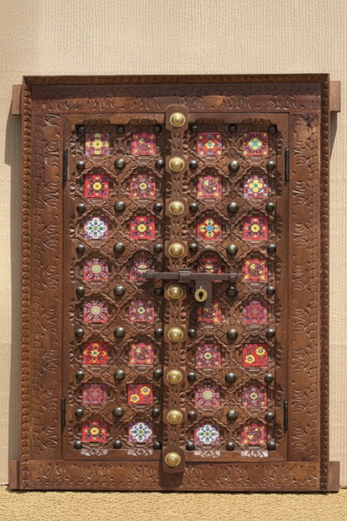 Copper brown double-door wall panel with pink glass tiles – front hero in warm entryway