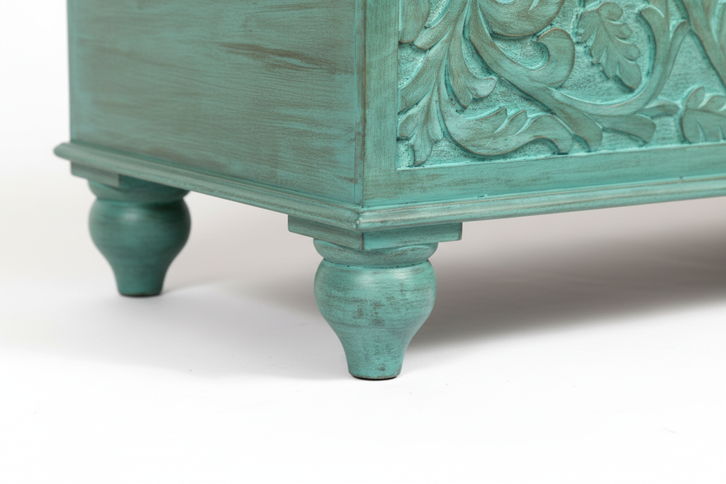 Hand-carved turquoise mango wood storage trunk – ball-turned feet detail white background