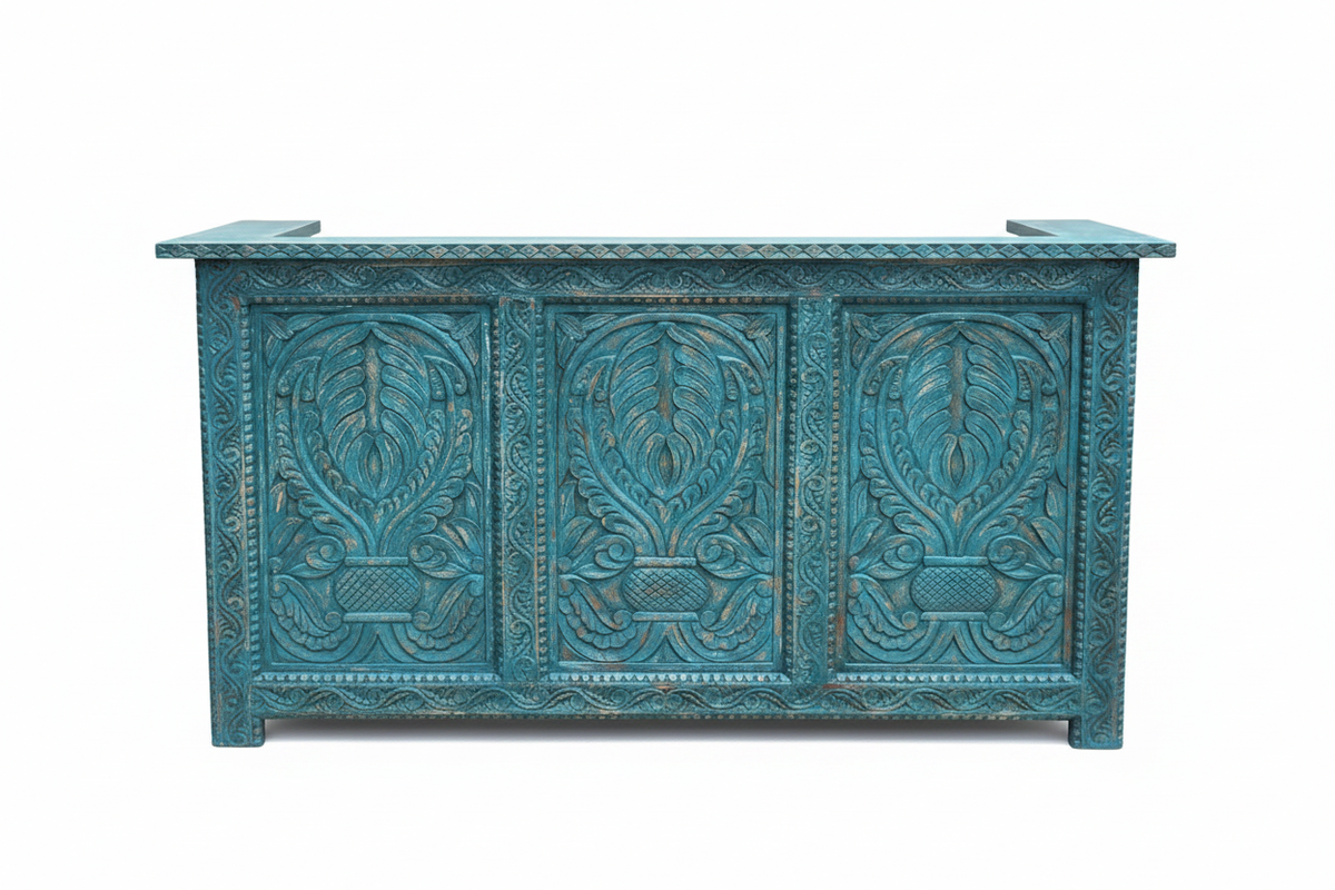 Distressed teal all-carved mango wood reception desk straight-on front view on white background