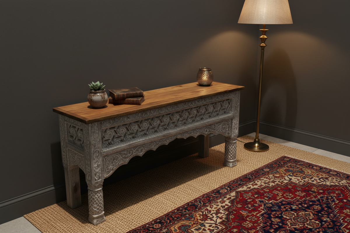 Hand-carved whitewash fretwork console table – elevated rear angle in moody bohemian room