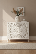 Hand-carved all-white medallion cabinet – front hero in warm living room