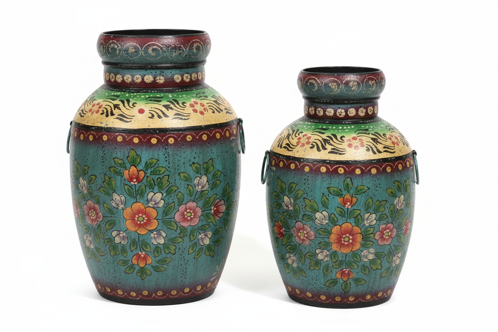 Large and small teal floral metal urn vases side by side on white background