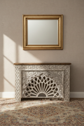 Hand-carved whitewash sunburst cabinet – front hero in elegant living room