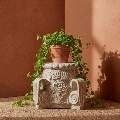 Antique white pedestal stool – plant stand in bohemian terracotta corner