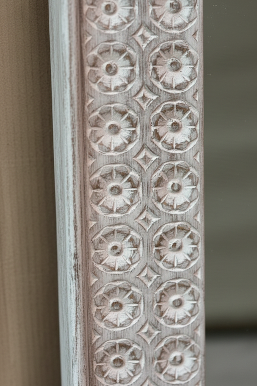 Close-up of hand-carved rosette flower heads within octagonal border tile repeat on frame