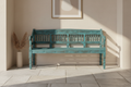 Hand-carved turquoise mango wood bench – front hero in warm entryway