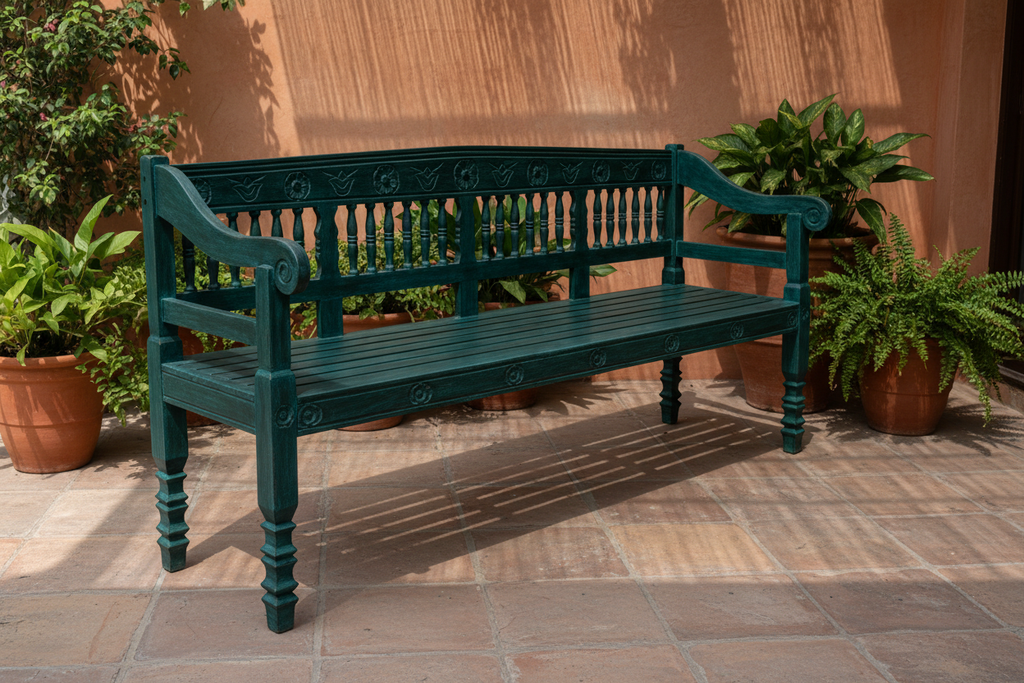 Hand-carved dark teal mango wood bench – left angle on covered outdoor terrace
