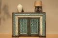 Hand-carved teal sideboard cabinet – hero front view in warm living room