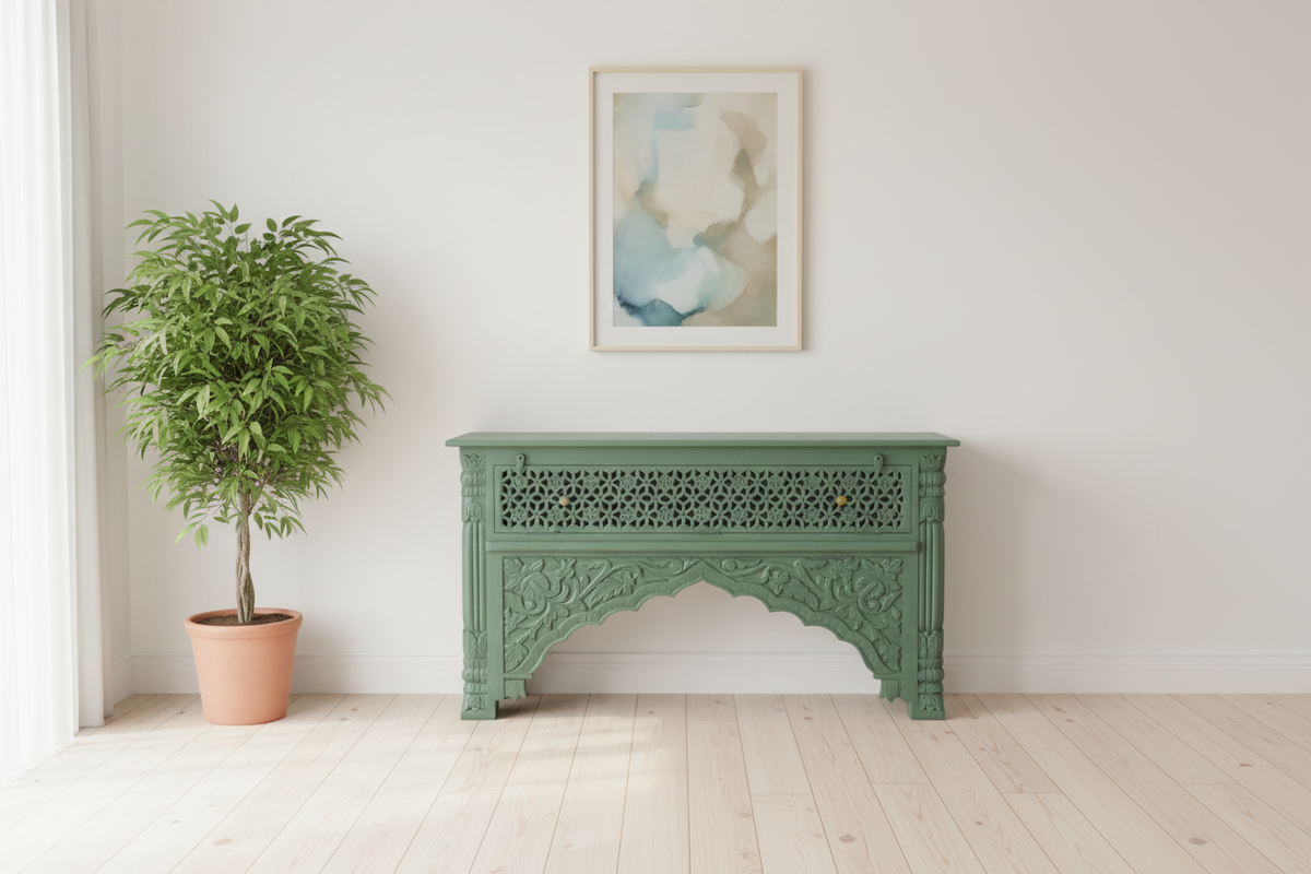 Hand-carved sage green console table – minimalist hallway with plant and art