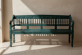 Hand-carved dark teal mango wood bench – front hero in warm entryway
